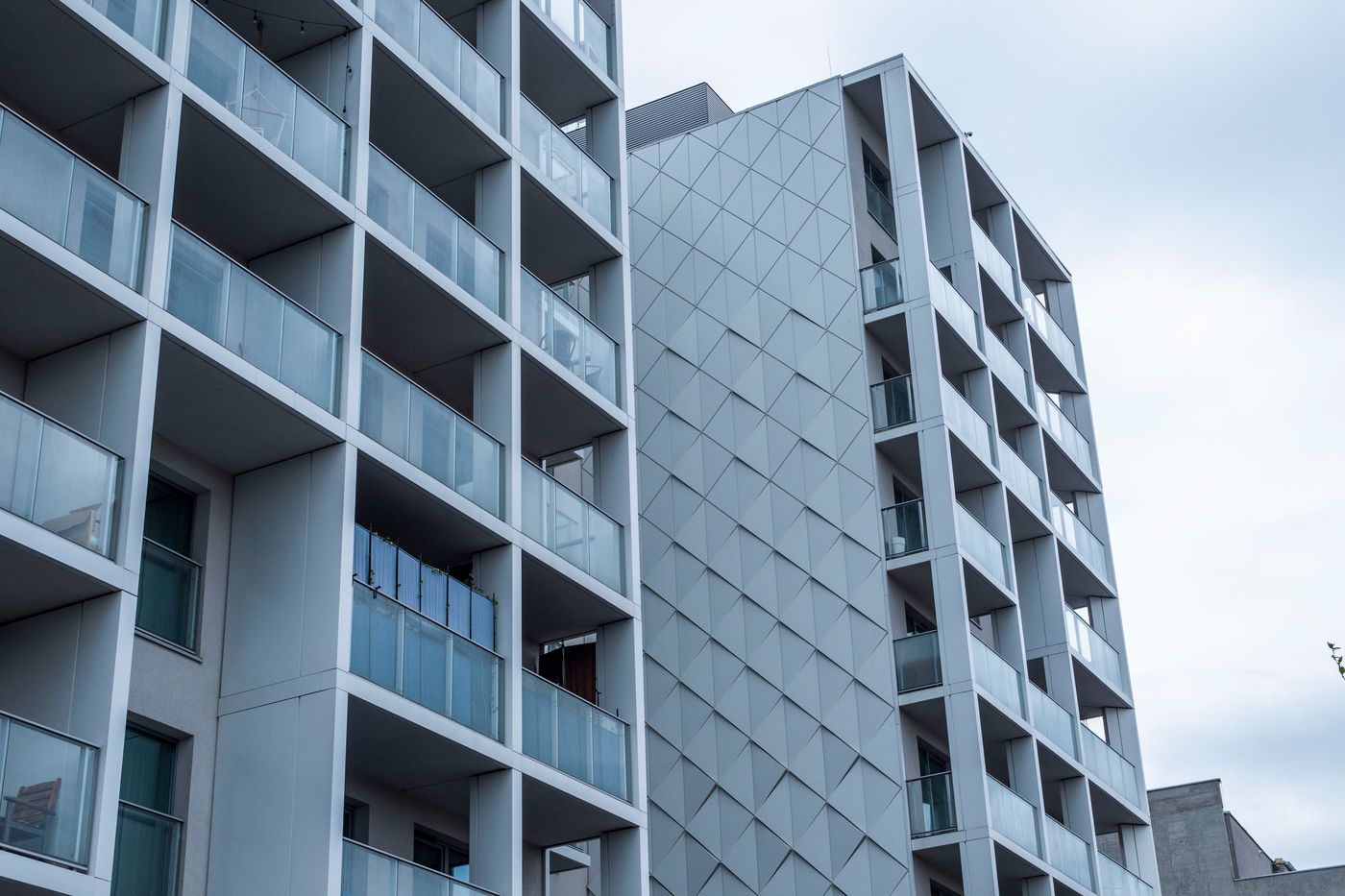 Real architectural photograph of modern apartment balconies and a residential facade
